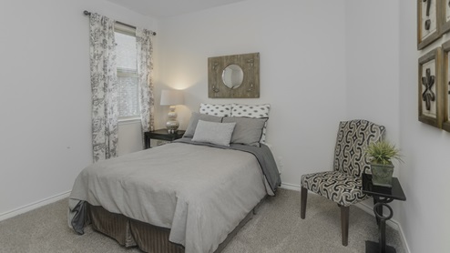 Bedroom with bedroom furniture and a window