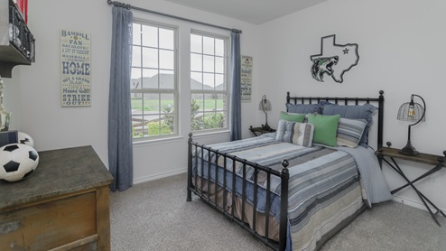Bedroom with bedroom furniture and a window