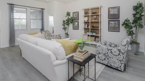 Living area with windows and beautiful furnishings