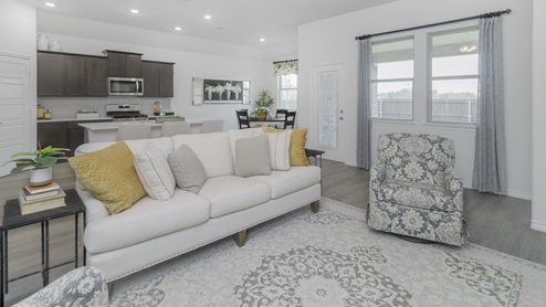 Living area with windows and beautiful furnishings