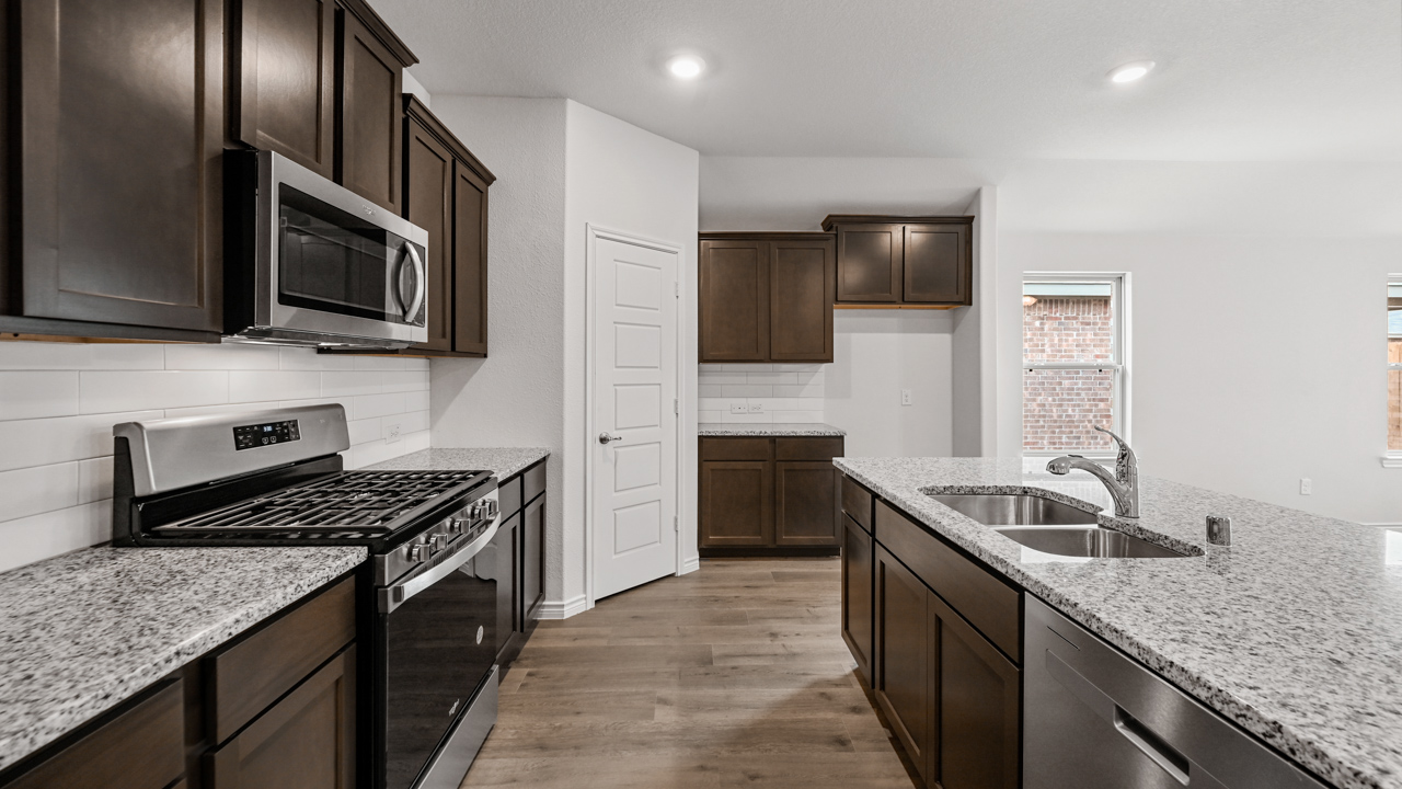 kitchen with dark cabinets