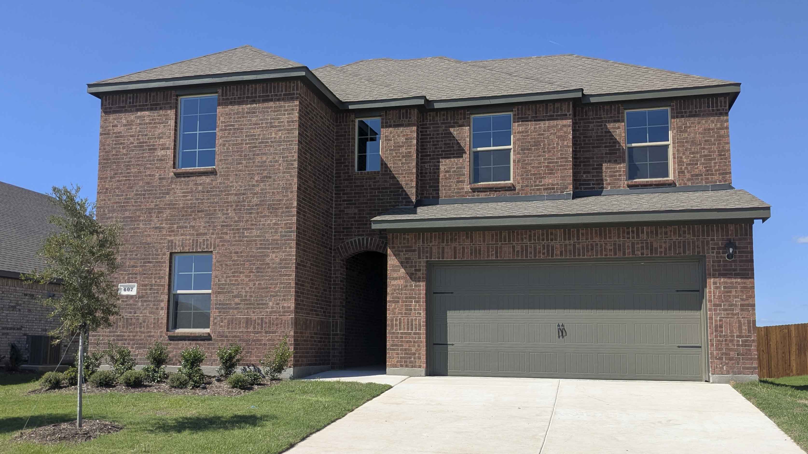 two story home with two car garage
