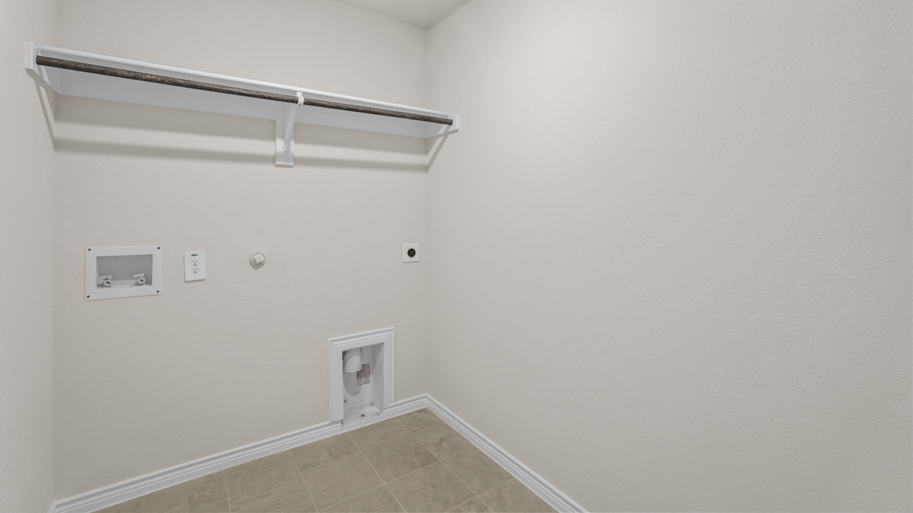 utility room with storage shelf and hanging rod