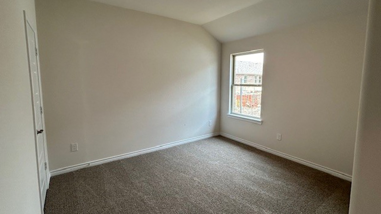 secondary bedroom with windows providing natural light