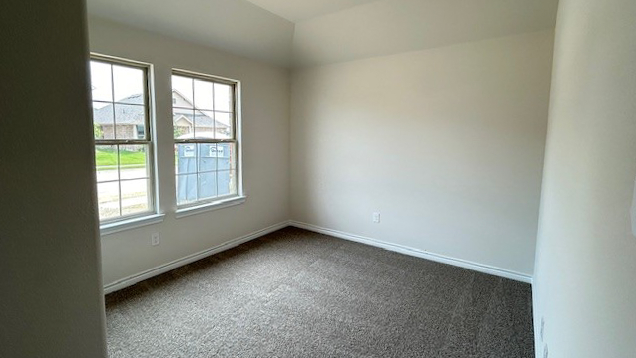 secondary bedroom with windows providing natural light