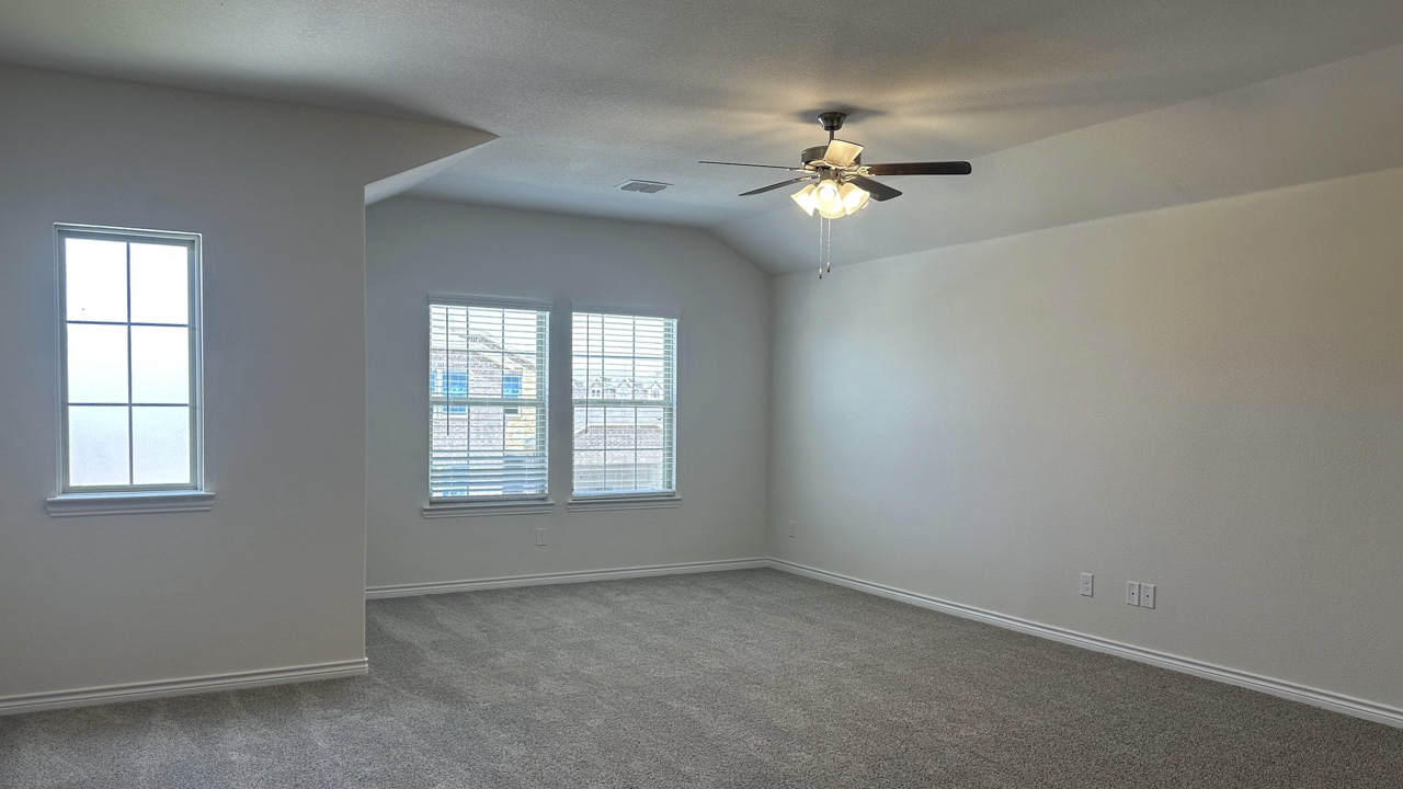 gameroom area with carpet and large windows providing natural light