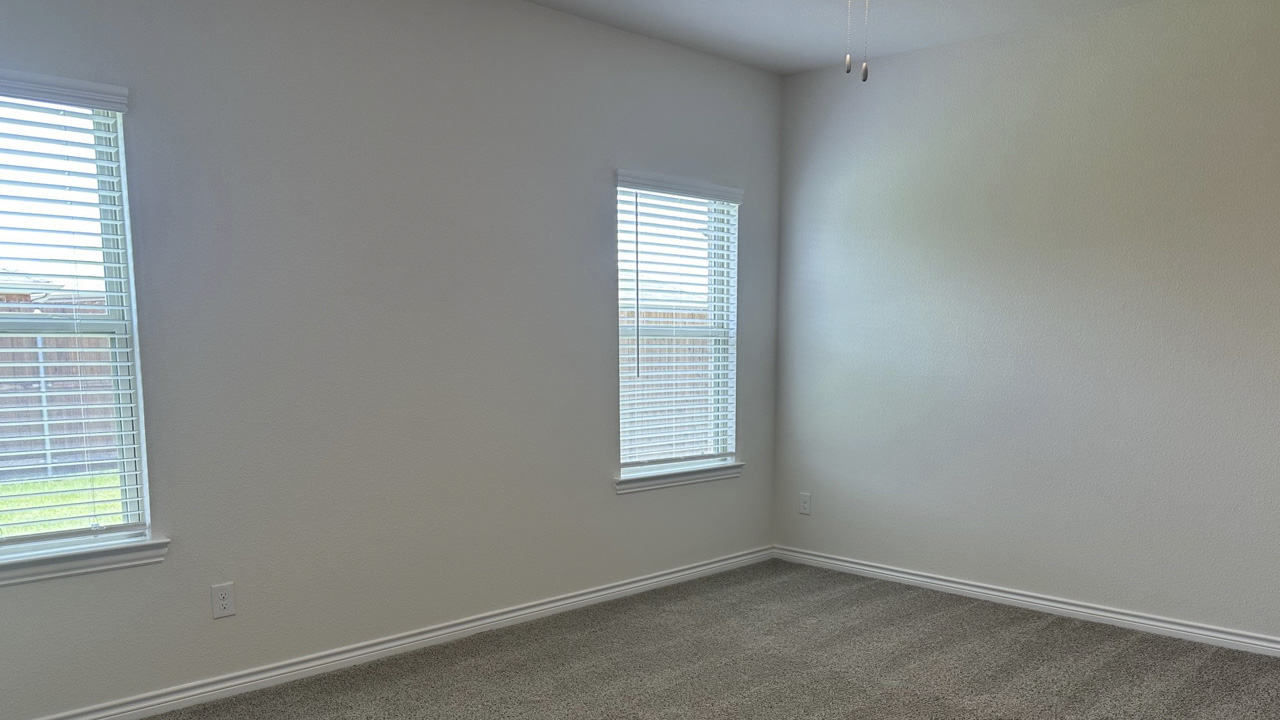 primary bedroom with large windows