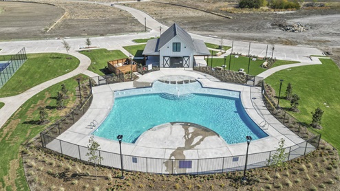 an aerial view of the amenity center and large swimming pool