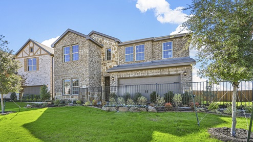 two story model home with brick and stone