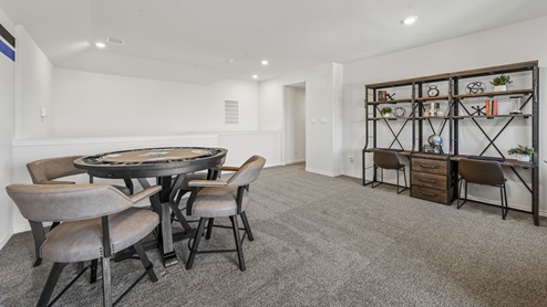 upstairs media room with furniture