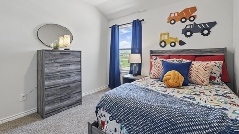 a bedroom decorated for a boy