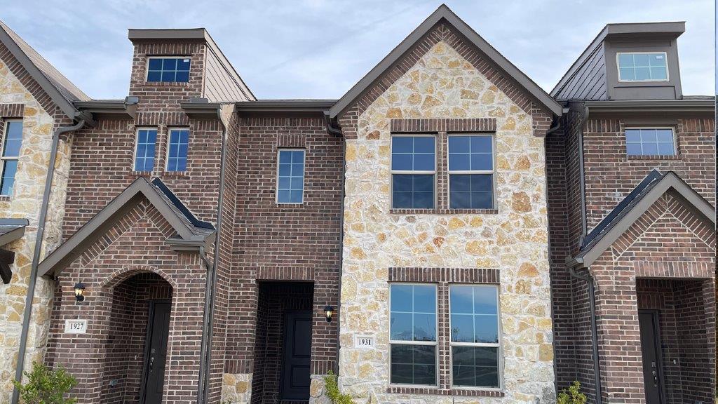 Two story townhome with stone exterior