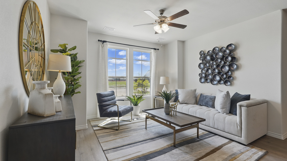 open concept living area with hardwood floors and natural light coming from large windows