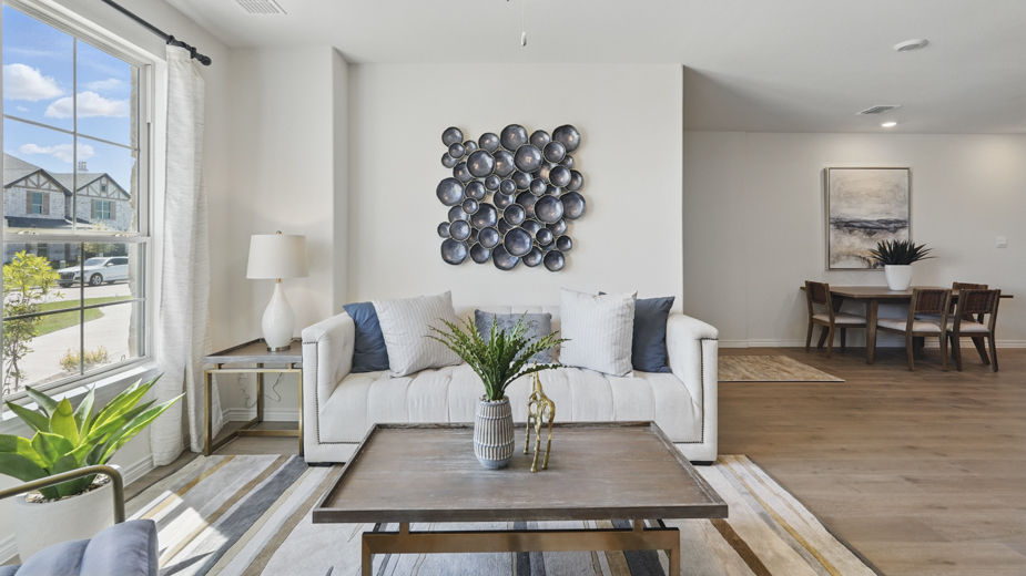 open concept living area with hardwood floors and natural light coming from large windows