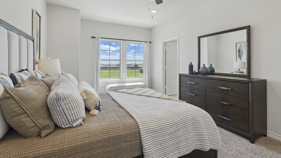 primary bedroom with large windows providing natural light to the entire room