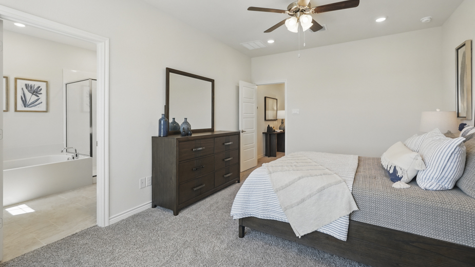 primary bedroom with large windows providing natural light to the entire room