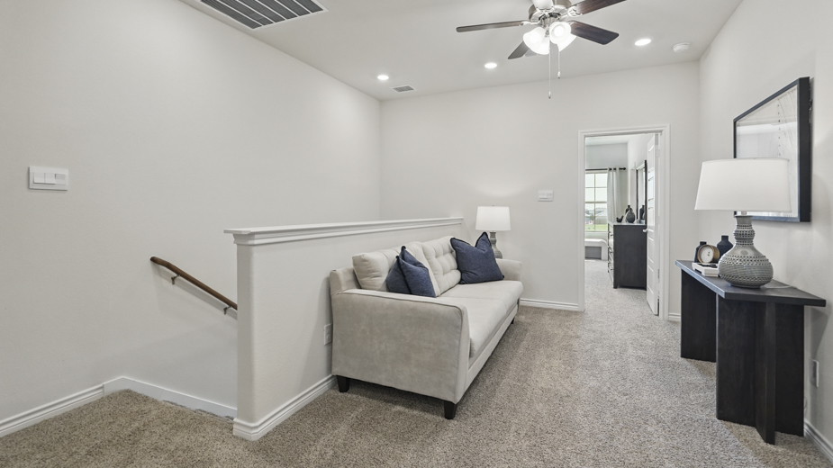 upstairs loft area with carpet