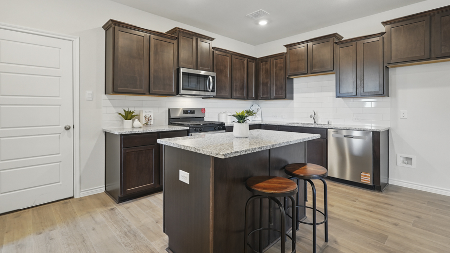 kitchen area with hardwood floors and kitchen island