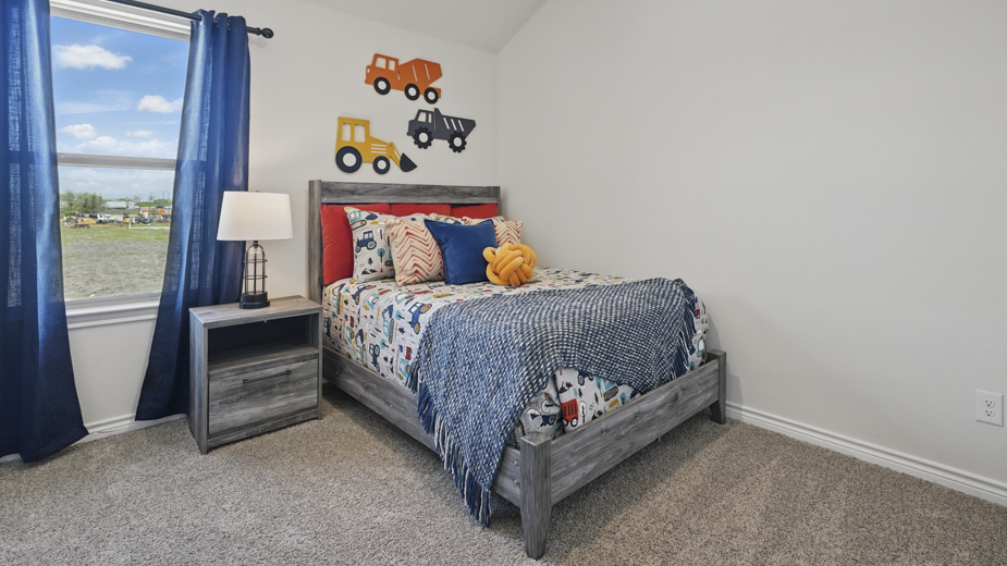 secondary bedroom with carpet and natural light coming from large window