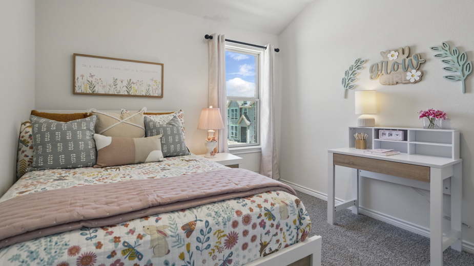 secondary bedroom with carpet and natural light coming from large window
