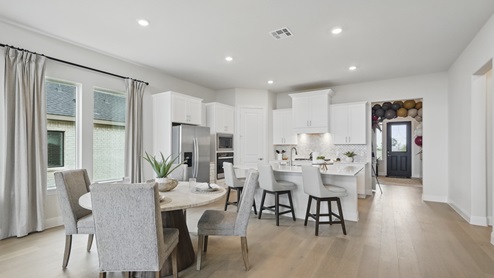 Interior dining area looking over into the kitchen