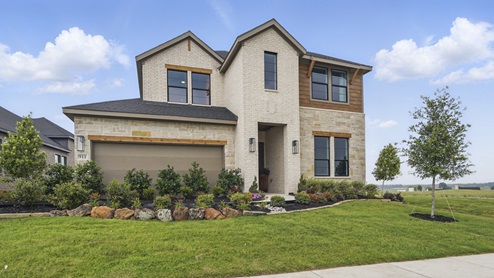 Exterior of two story brick house with two car garage