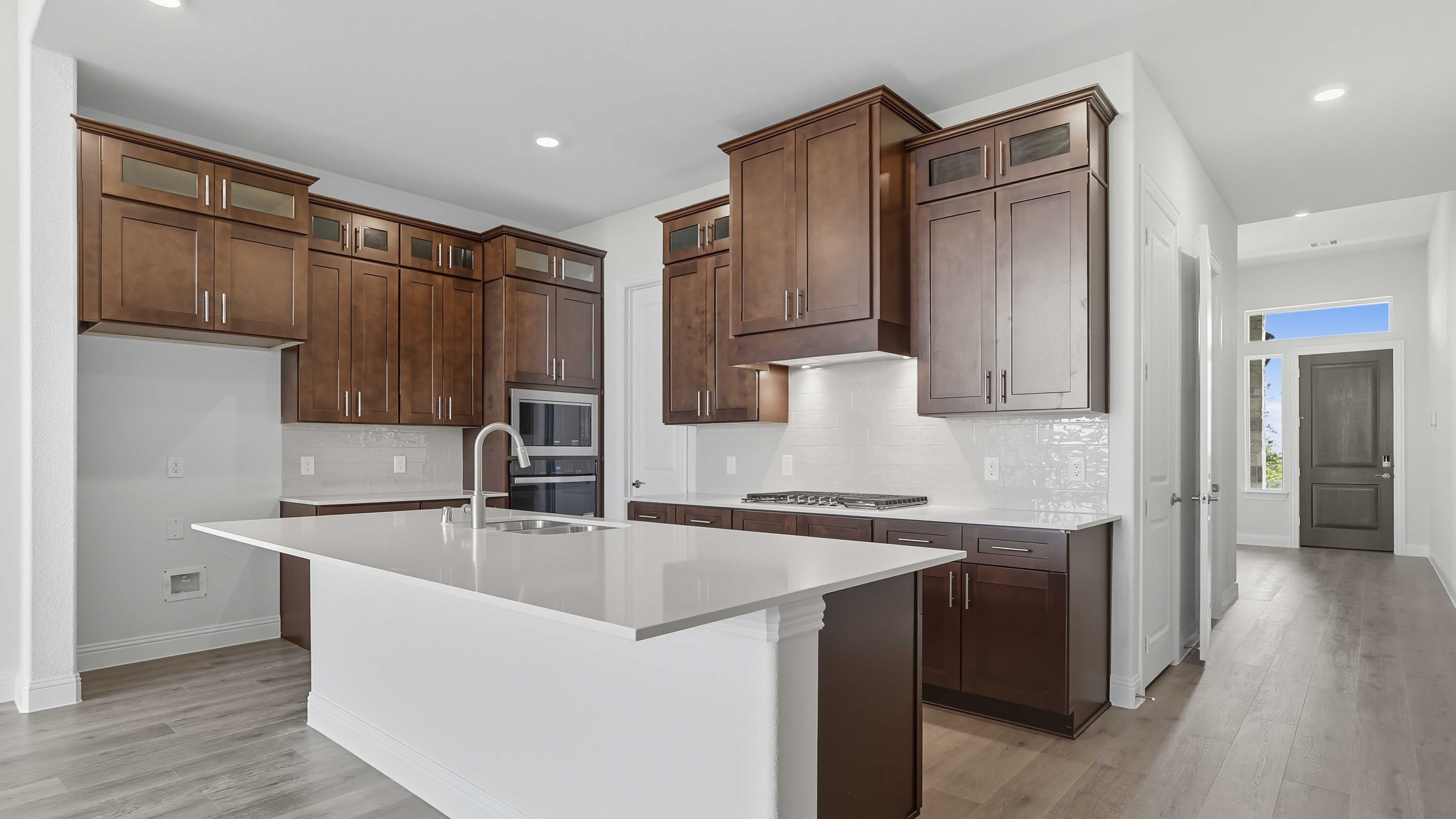 kitchen and interior entrance with hardwood floors