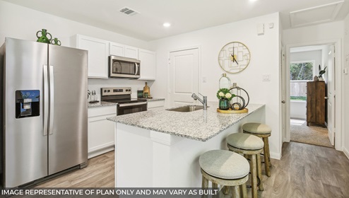Cottage series one story home kitchen with stainless steel appliances