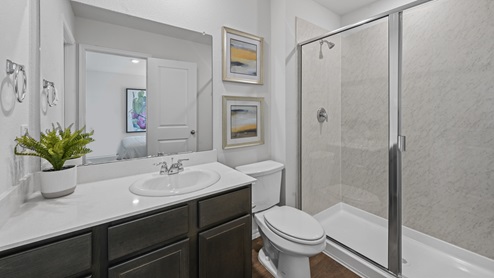 V19 Plan Primary bathroom with vanity and oversized shower