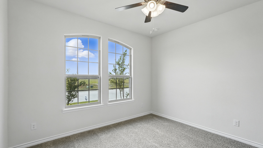 Bedroom with carpeted floors and a closet.