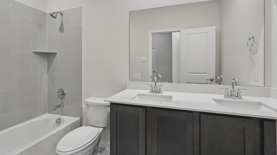 Bathroom with double vanity sinks.