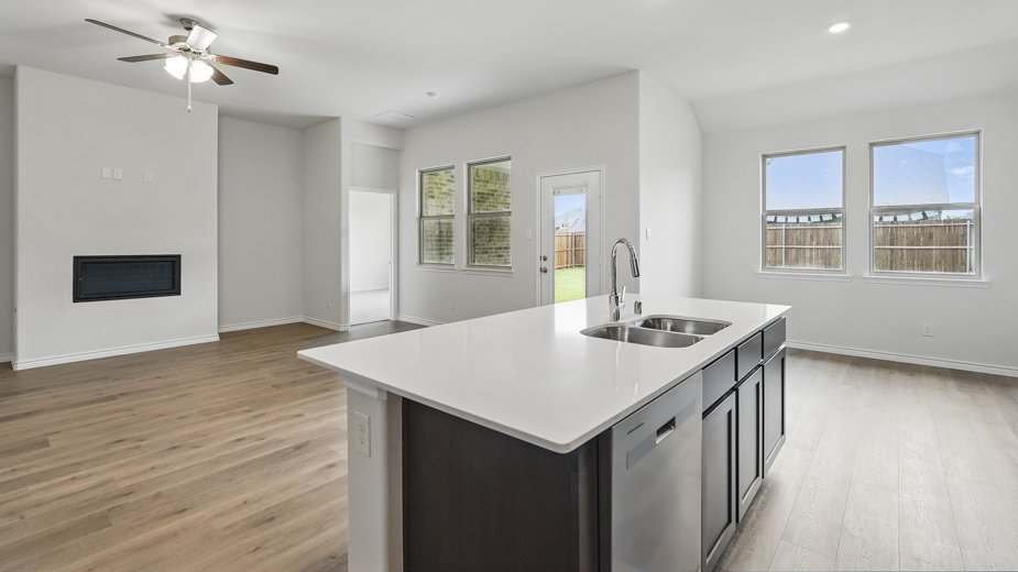 Kitchen with windows for natural lighting.
