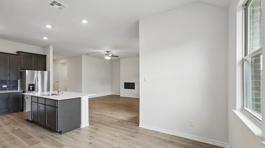 Open concept living room with fireplace.