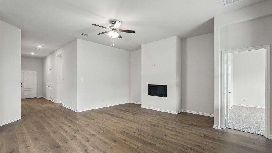 Open concept living room with fireplace.
