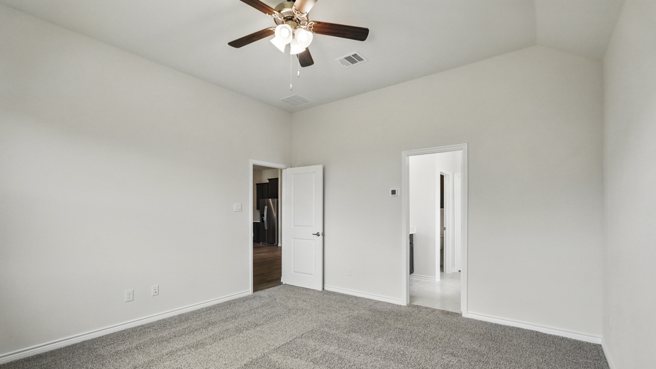 Bedroom with carpeted floors and a closet.