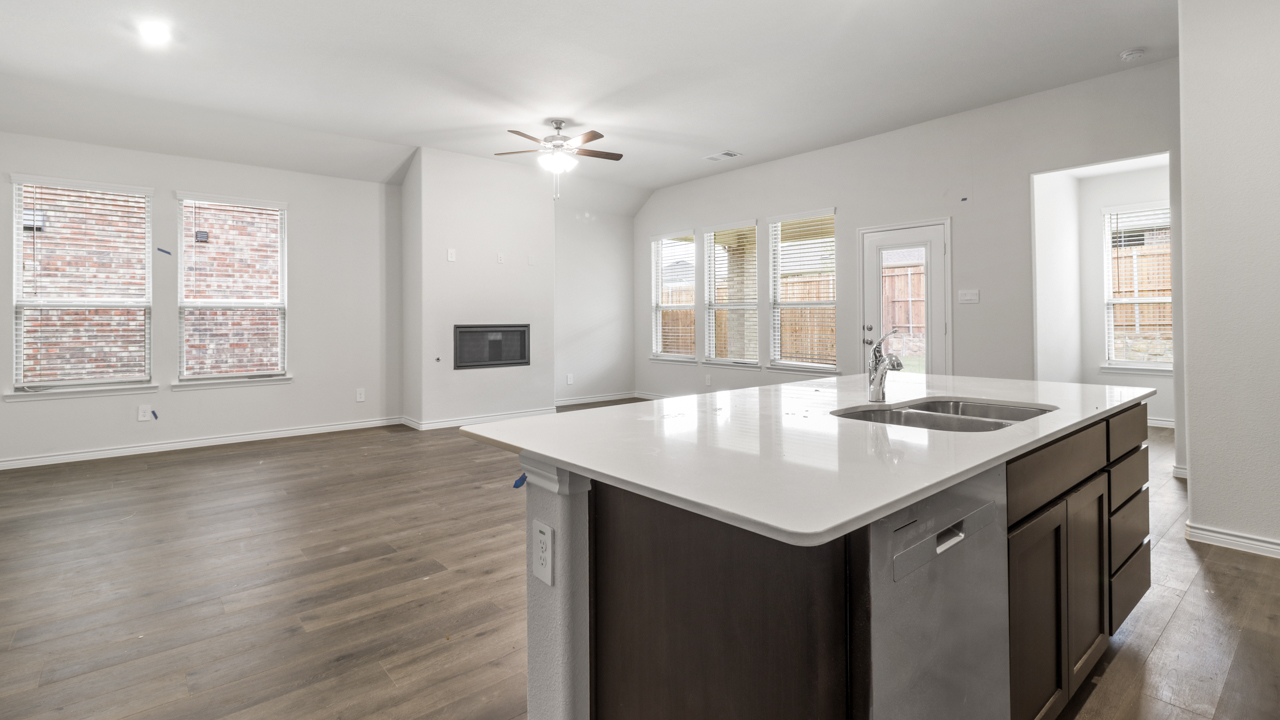 large living room and kitchen island with granite countertops