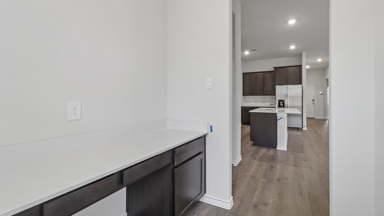 built in desk area next to kitchen