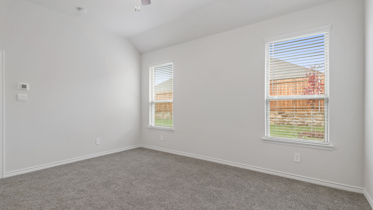 primary bedroom with two windows