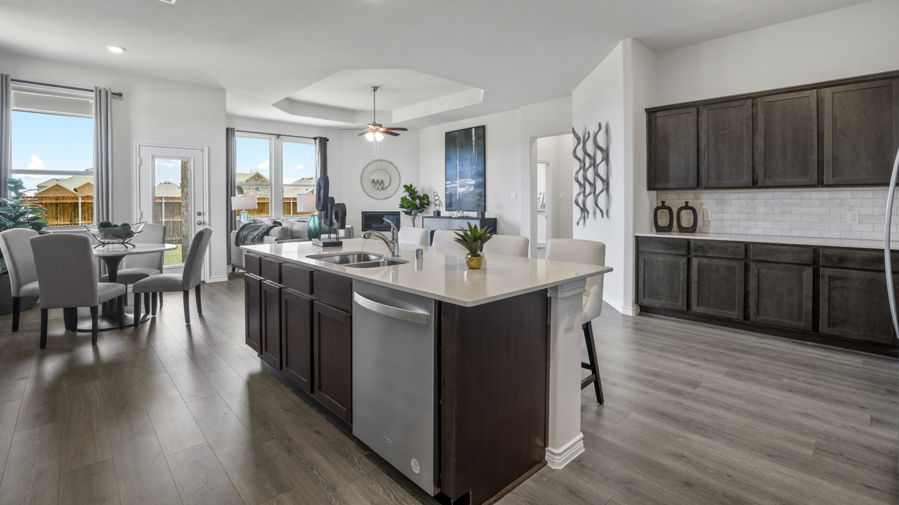 Large kitchen with island and brown cabinets