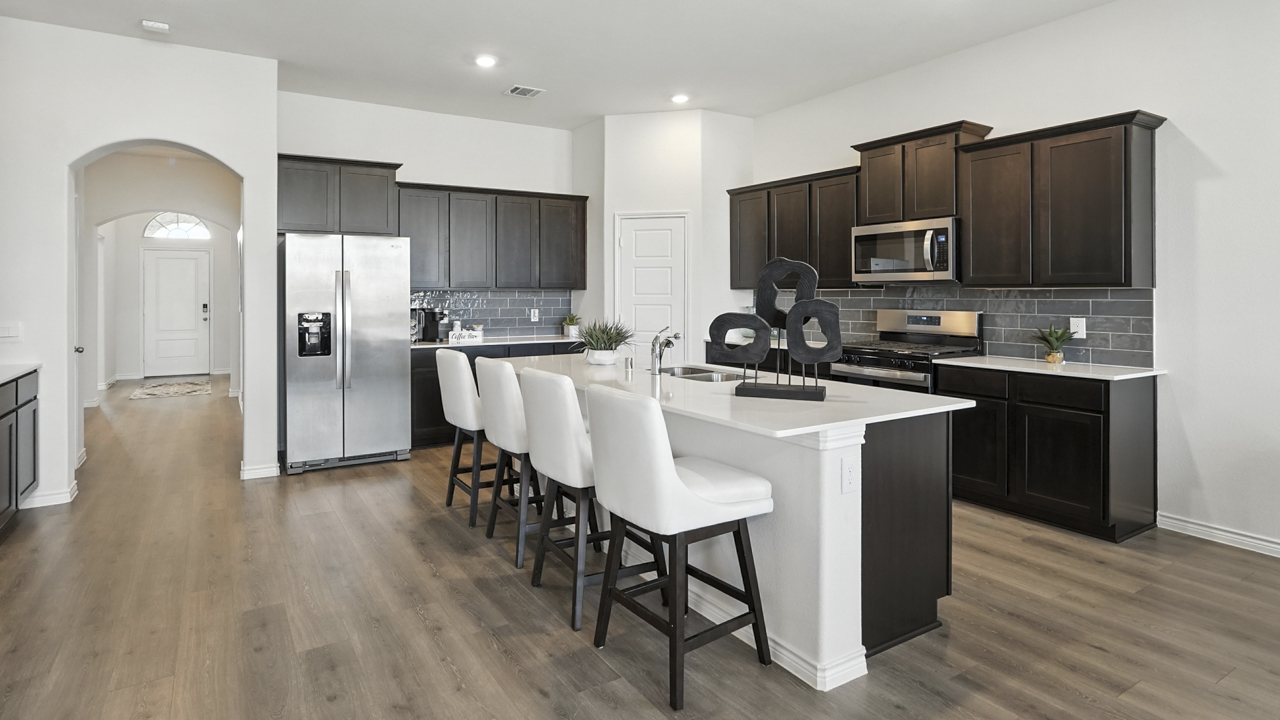 Large kitchen with island and brown cabinets