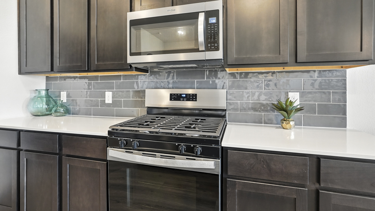 Large kitchen with island and brown cabinets