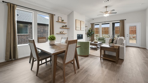 large open concept living room with large windows and furniture
