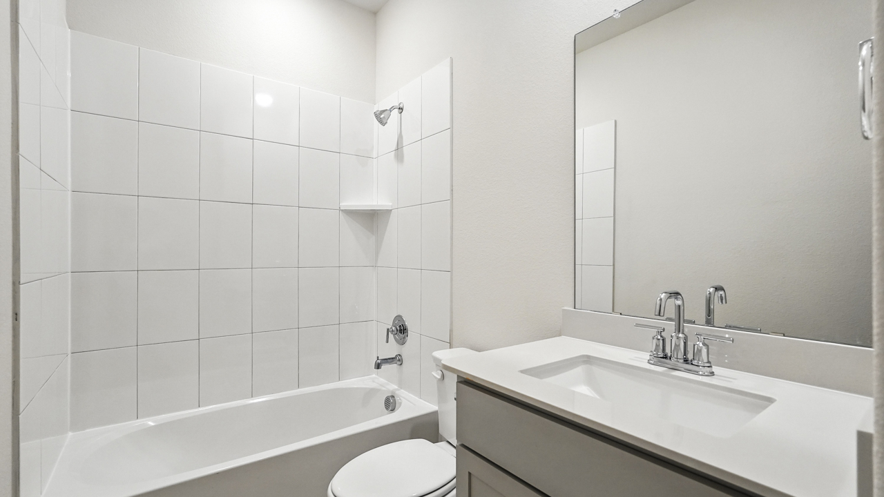 primary bathroom with double vanity sinks.