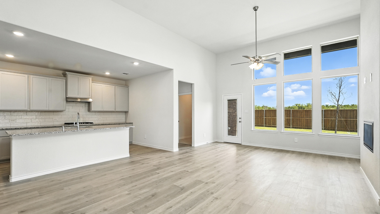 Large living room and windows next to kitchen