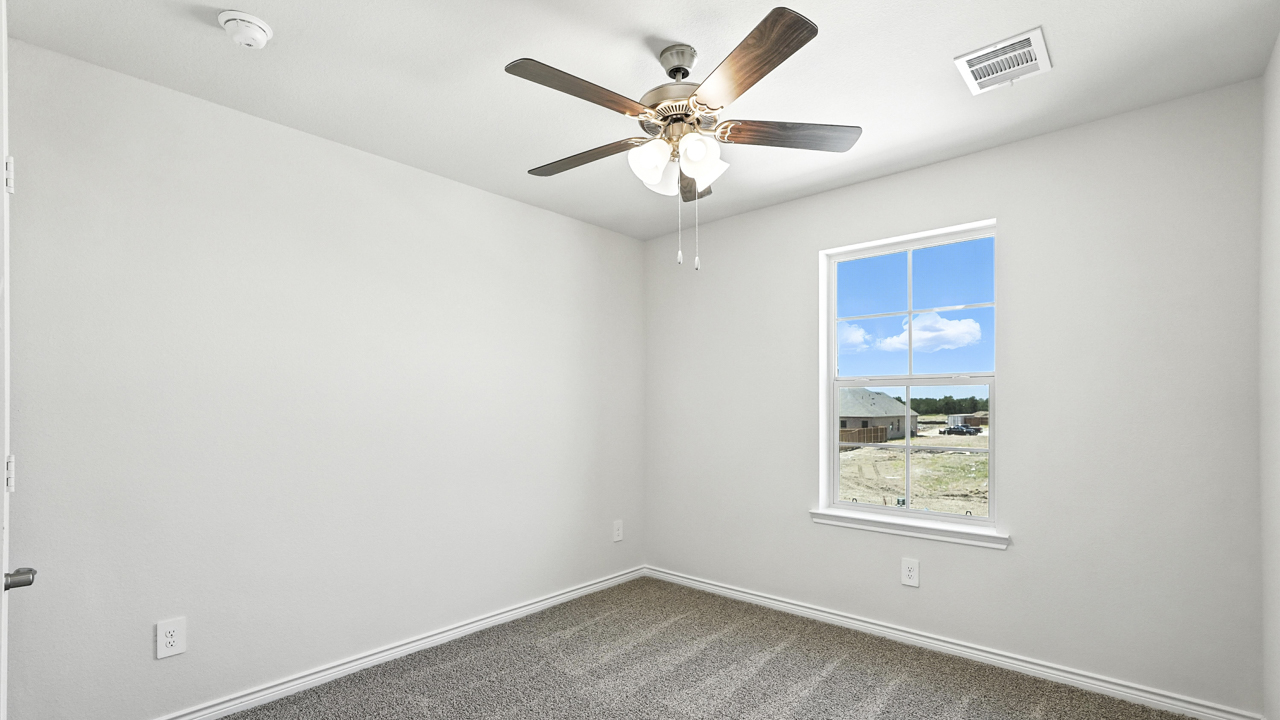 bedroom with window and ceiling fan