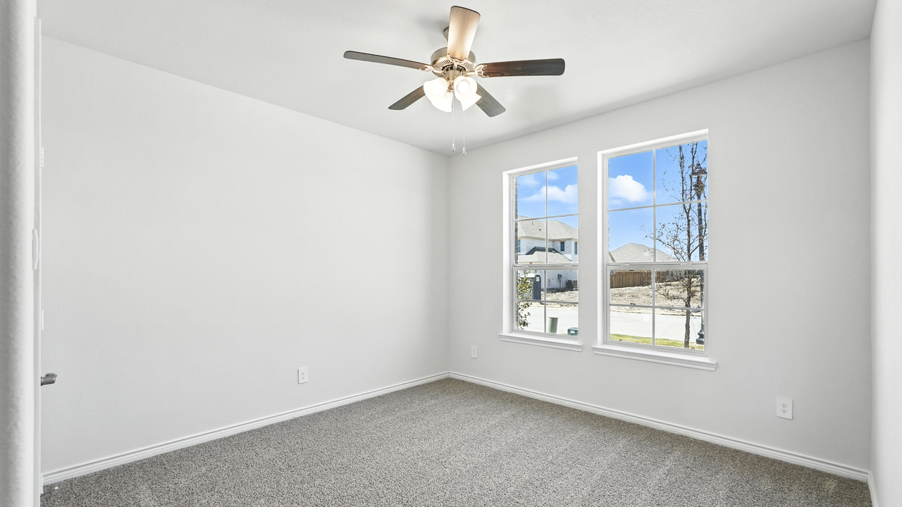 bedroom with window and ceiling fan