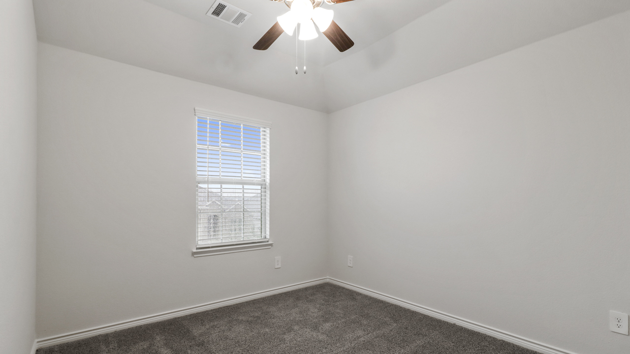 bedroom with window and ceiling fan