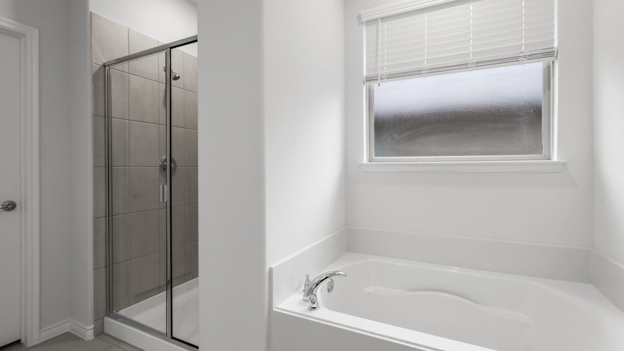 Primary walk in shower and garden tub