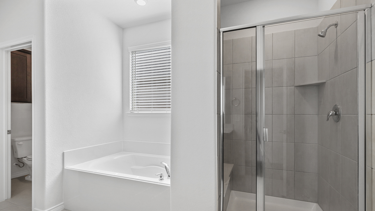 bathroom with a sepreate shower and bathtub