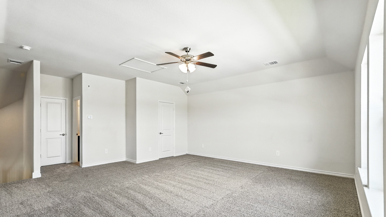 Upstairs carpeted loft area.